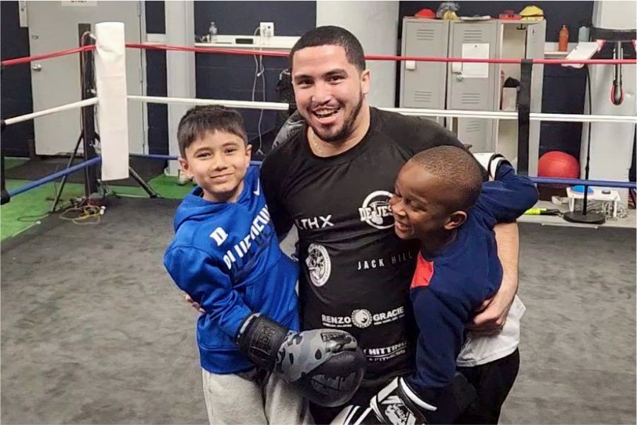 kids taking group photo after during boxing class with coach victor